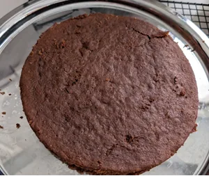 Brown cake on a silver cake stand
